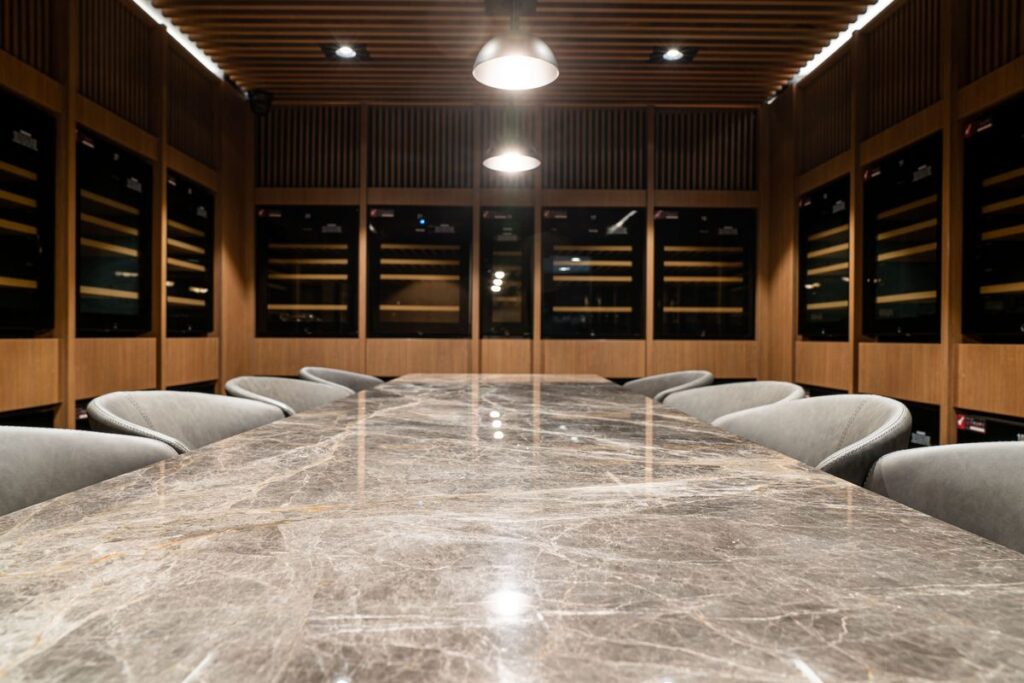 Natural stone table in a warm showroom setting